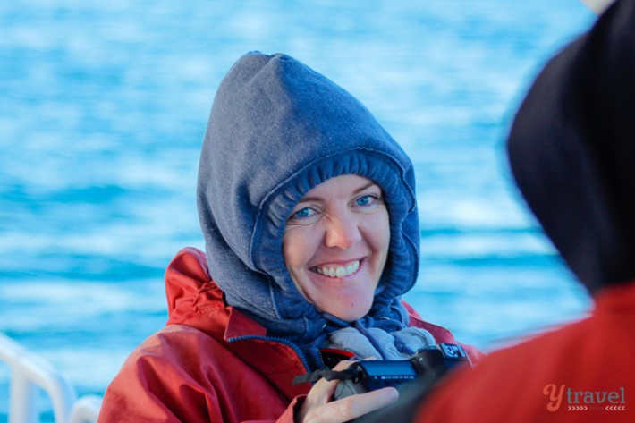 woman with camera smiling