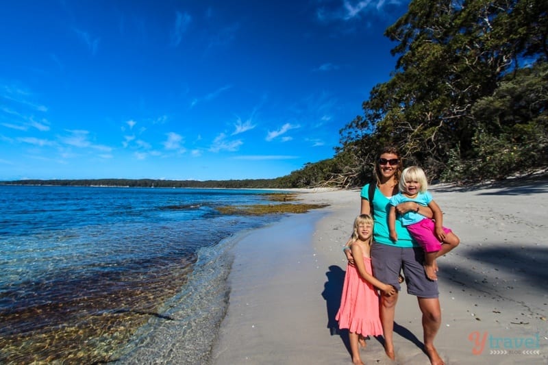 people standing on a beach