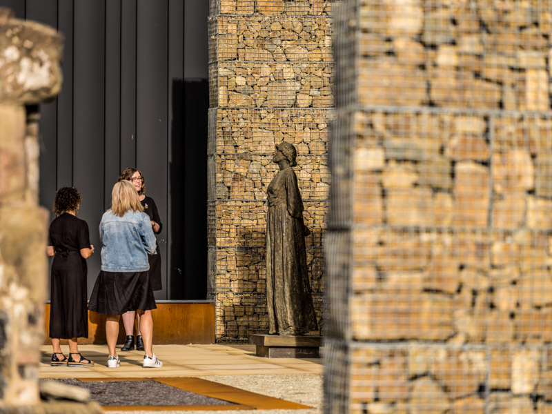 Person looking at statue at Cascades Female Factory Historic Site,