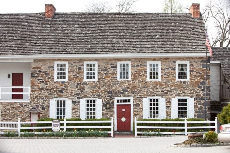 brick exterior Dobbin House Tavern with red door