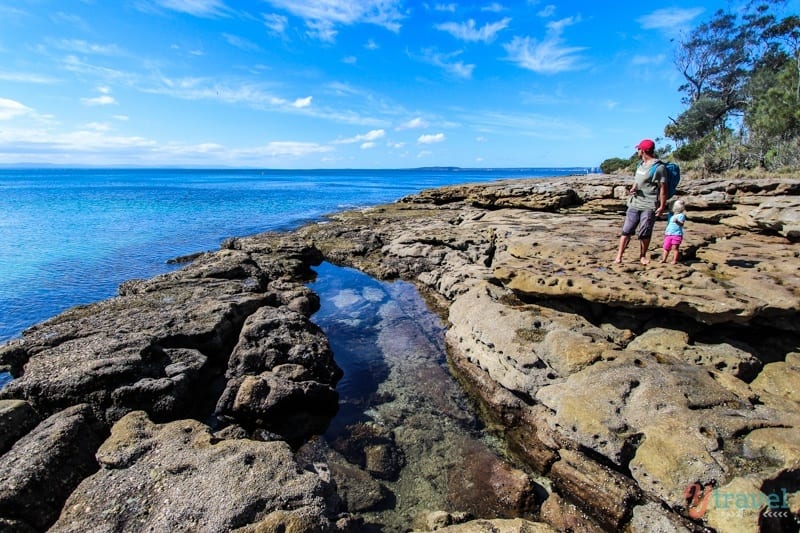 man and child walking on Scottish Rocks, Booderee National Park