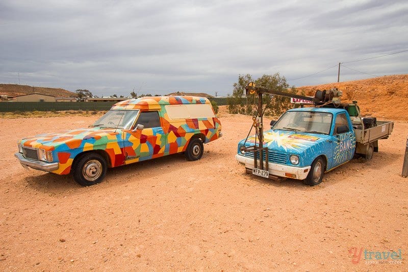 cars in a dirt valley