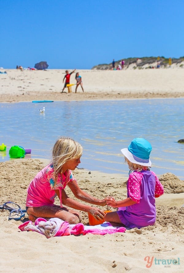 girls building castles on Prevelly Beach, 