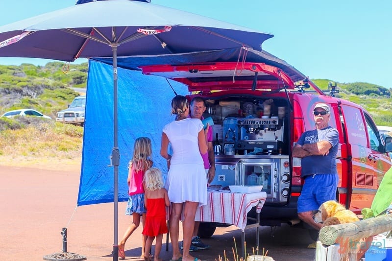 people ordering food out of a truck