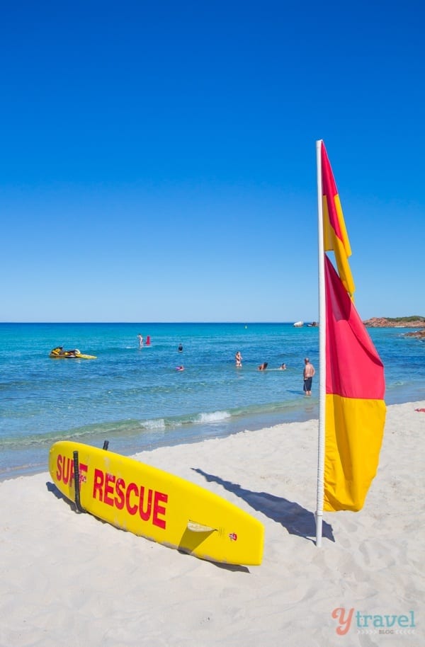 lifeguard flag and board on Meelup Bay beach