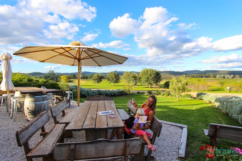 woman drinking wine at table in mudgee winery