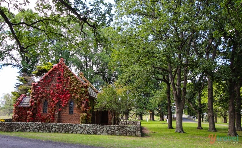 Gostwyck Chapel covered in red flowers