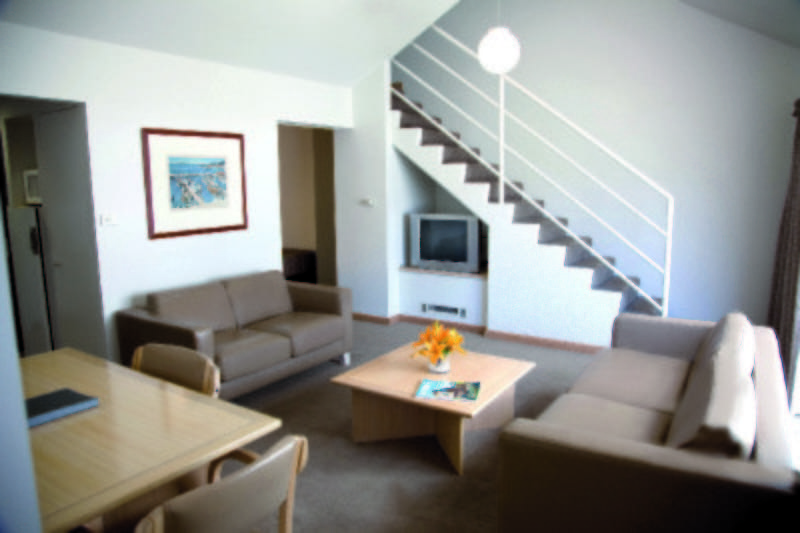 living area of family suite at salamanca inn