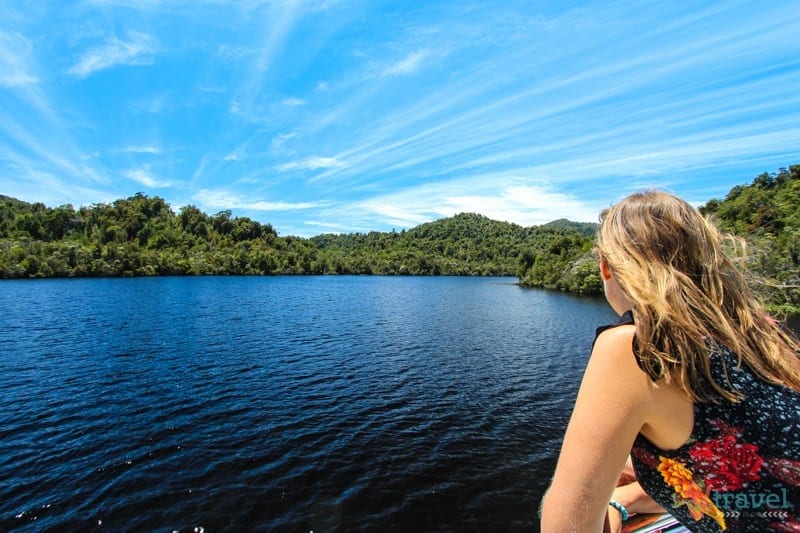 a woman looking out at a river