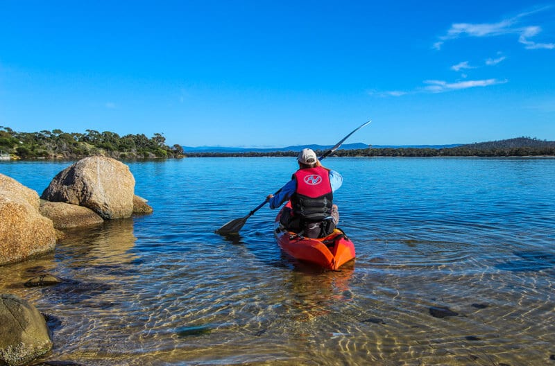 persona kayaking Coles Bay - Tasmania, Australia