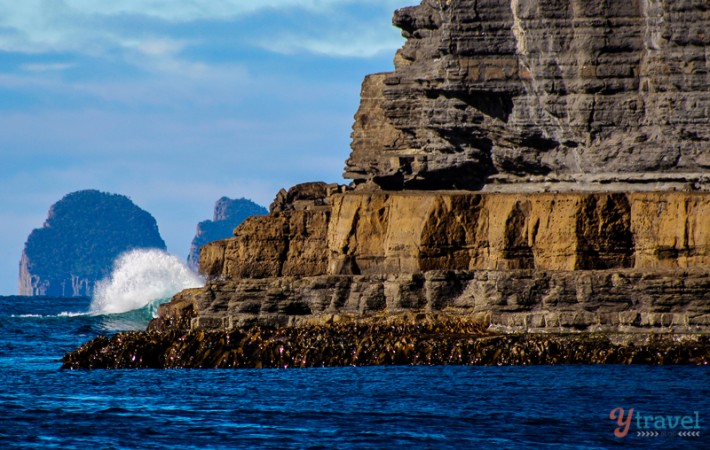 waves pounding against the cliffs