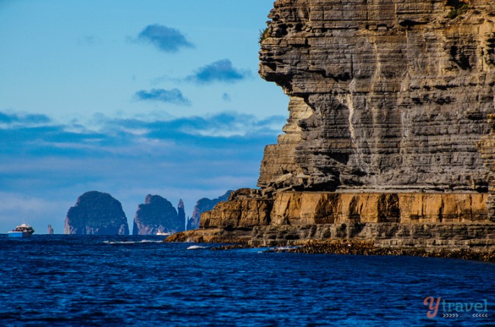 a rock cliff in the ocean