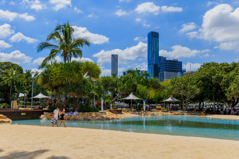 Couple at Streets Beach overlooking the river and city