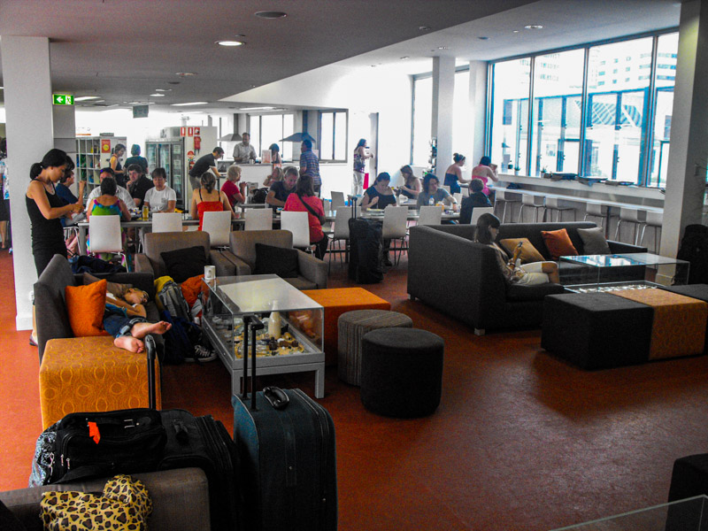 people sitting in common room of hostel