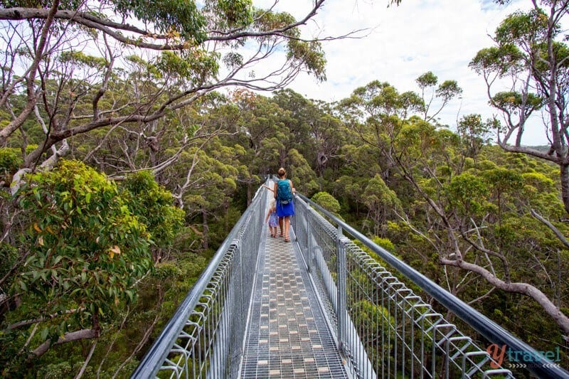 people walking on a bridge 