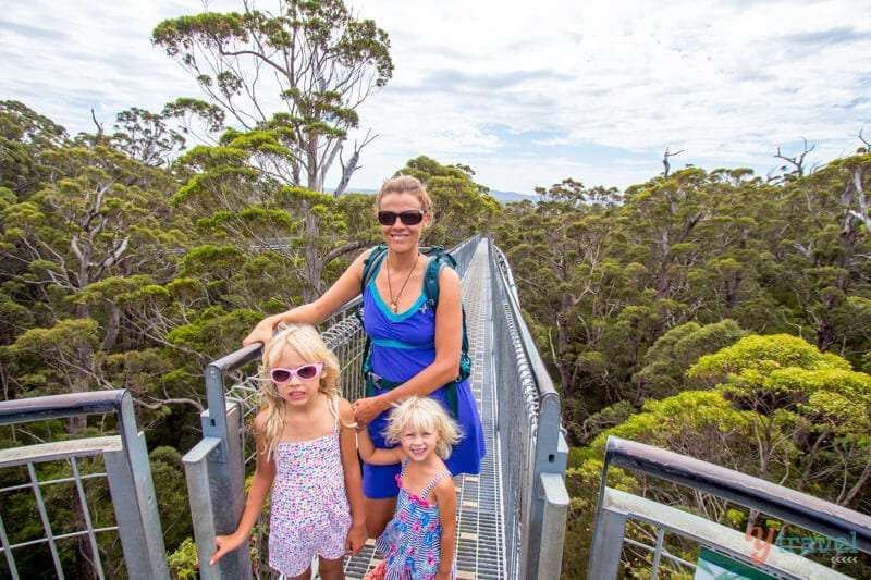 people standing on a bridge