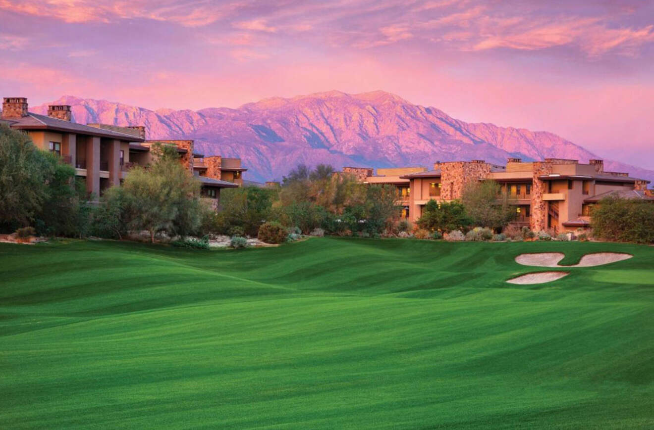 View of hotel at sunset with mountains in the background