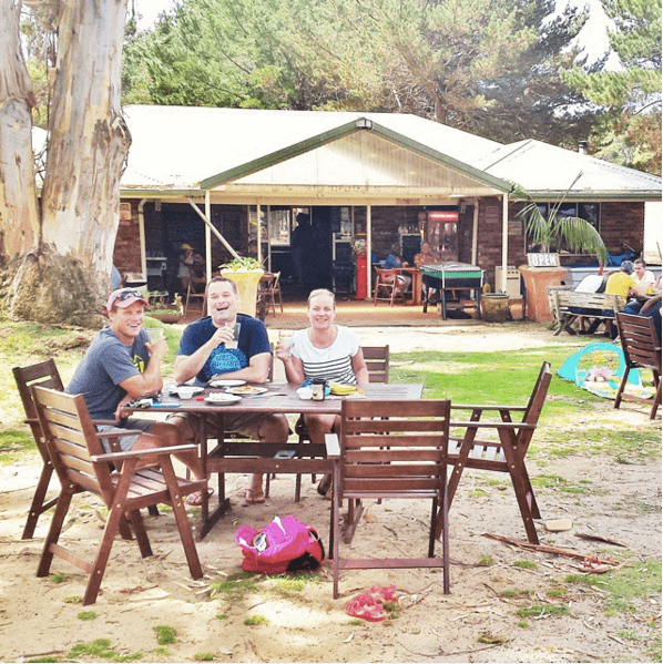 friends sitting at table in beer garden at Bush Shack Brewery