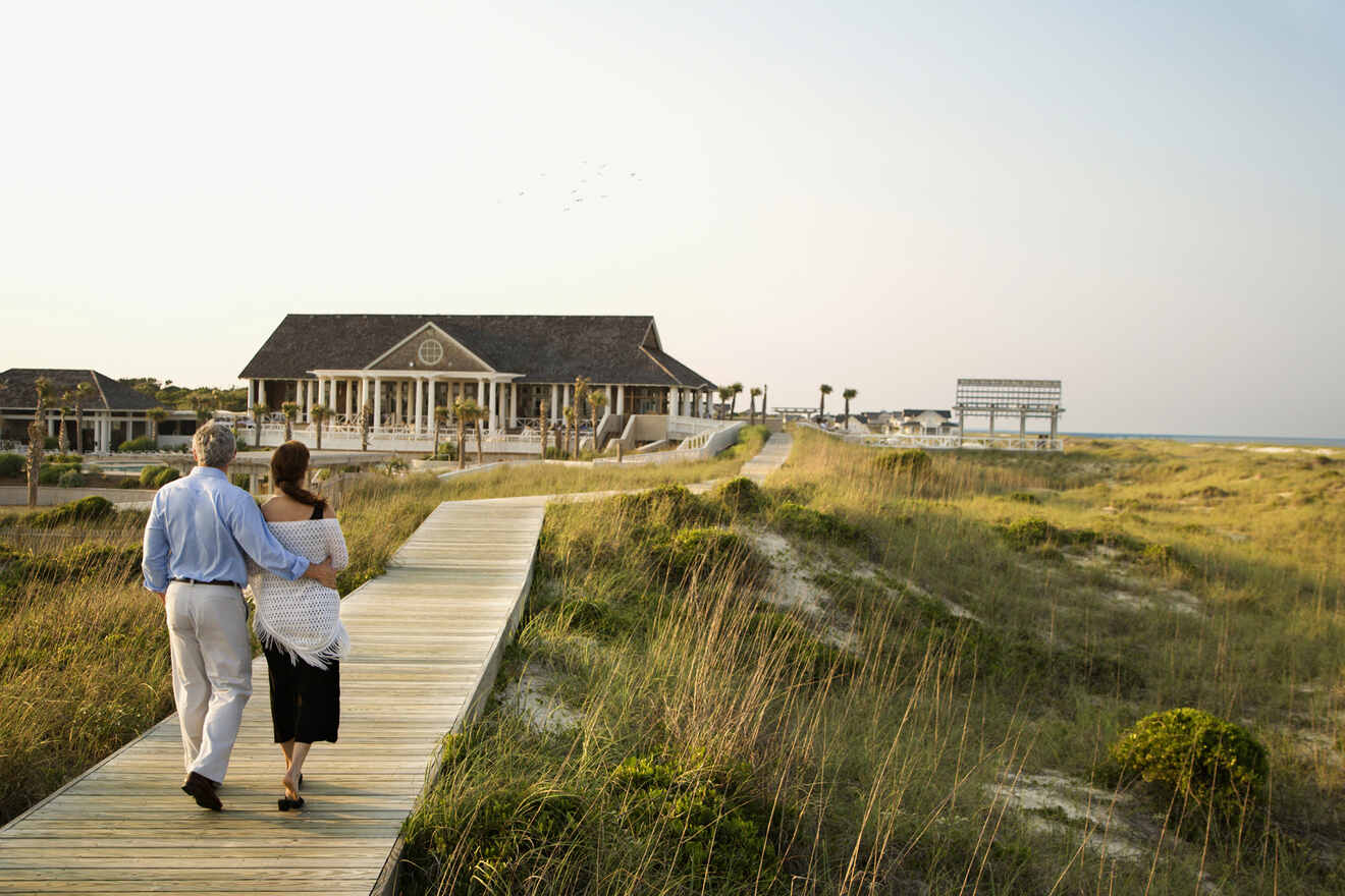 couple walking on a wooden footpath