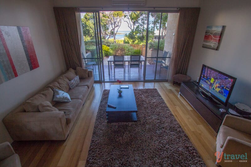 A living room filled with furniture and a large window