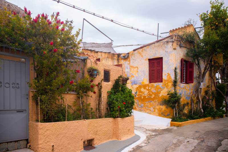 orange buildings with vines crawling up in Anafiotika athens