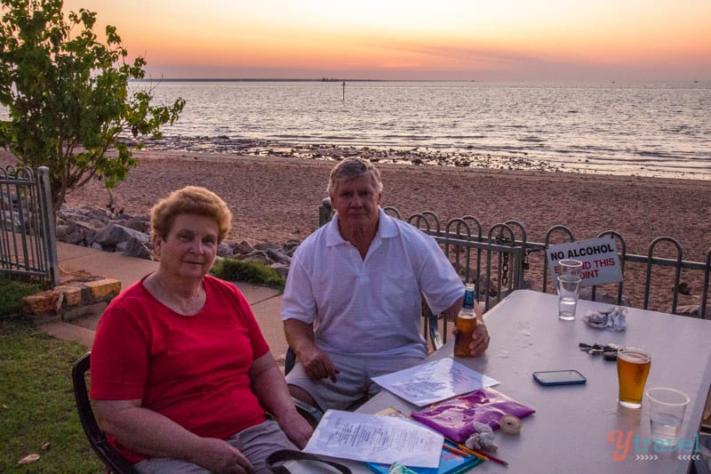 couple drinking Sunset drinks at the Ski Club in Darwin, with views of the beach