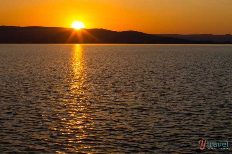 orange sunset over lake argyle