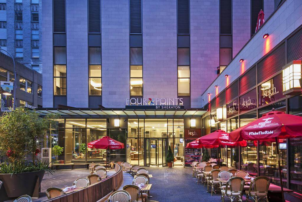 Four Points by Sheraton exterior with tables and chairs