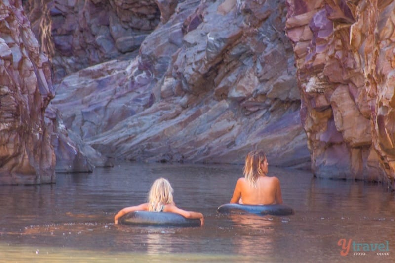 kalyra and caroline tubing down a river