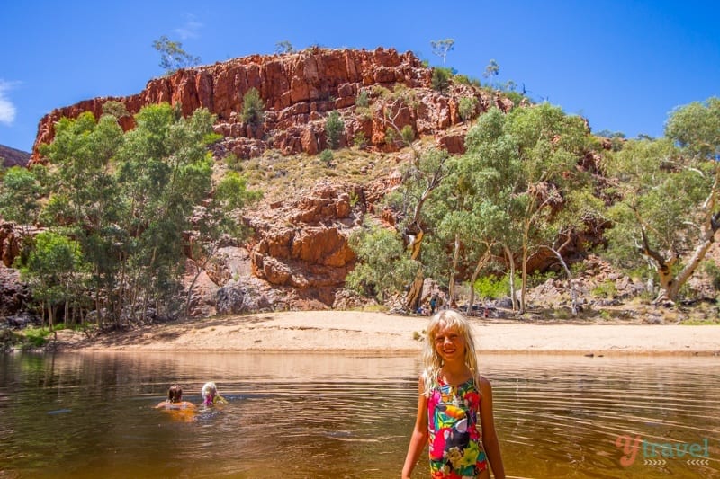 people swimming in a river