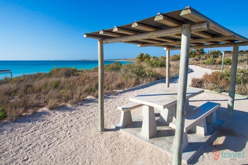 picnic table next to the beach