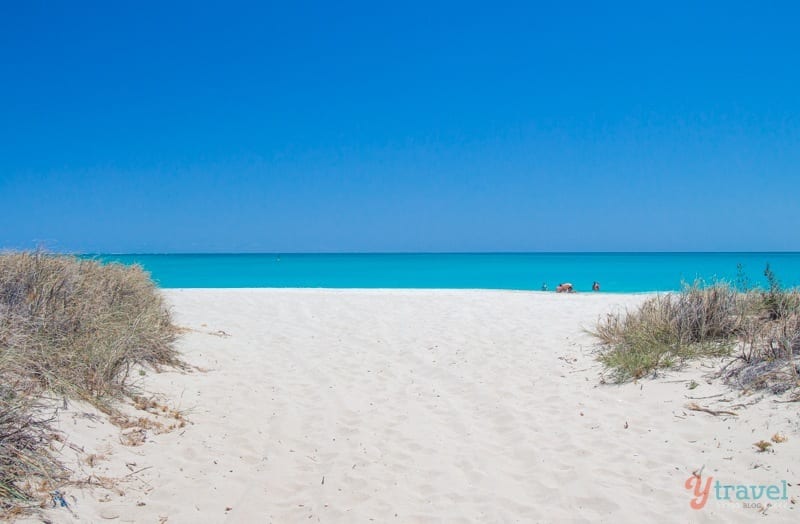 white sand beach and turquoise water of Coral Bay, Western Australia