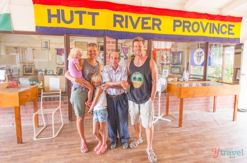 Makepeace family posing with prince leonard standing in front of a store