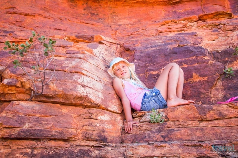 girl sitting on a rock