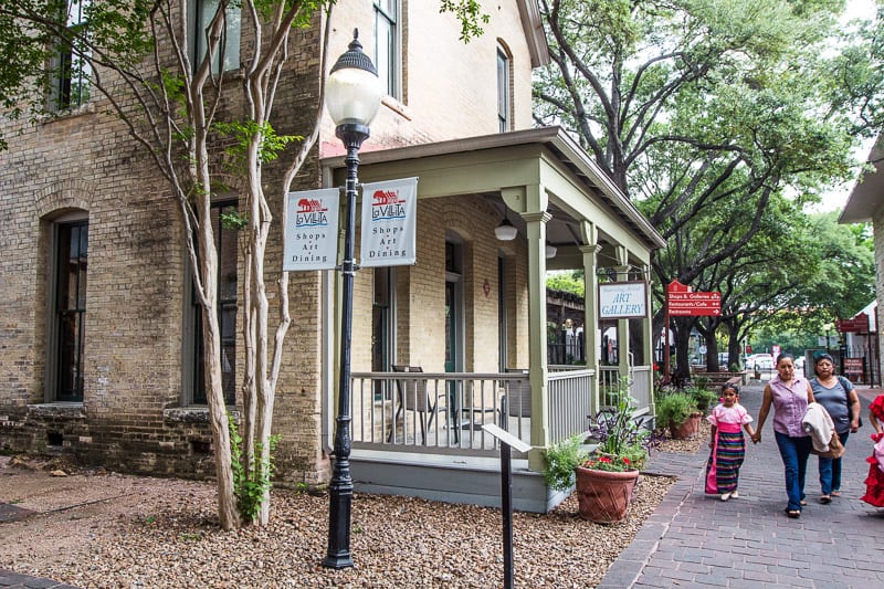 people walking through La Villita Historic Arts Village