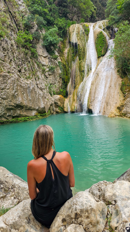 caz looking at Polylimnio Waterfall