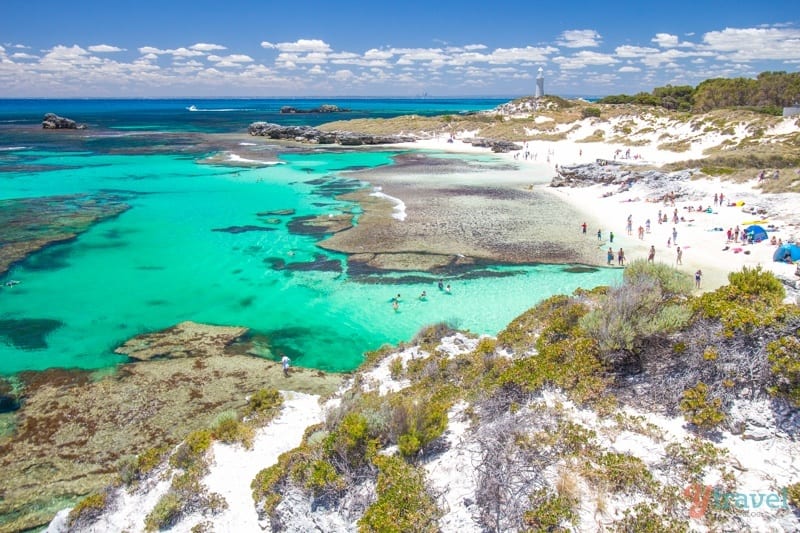 people on white sand Pinky Beach on Rottnest Island on eof the best things to do in Perth