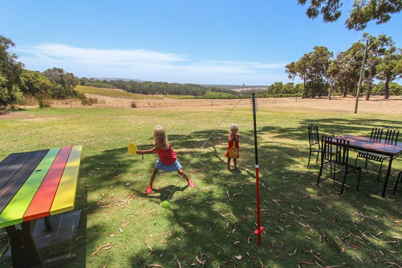 kalyra and savannah playing games on garden at Swings and Roundabouts 