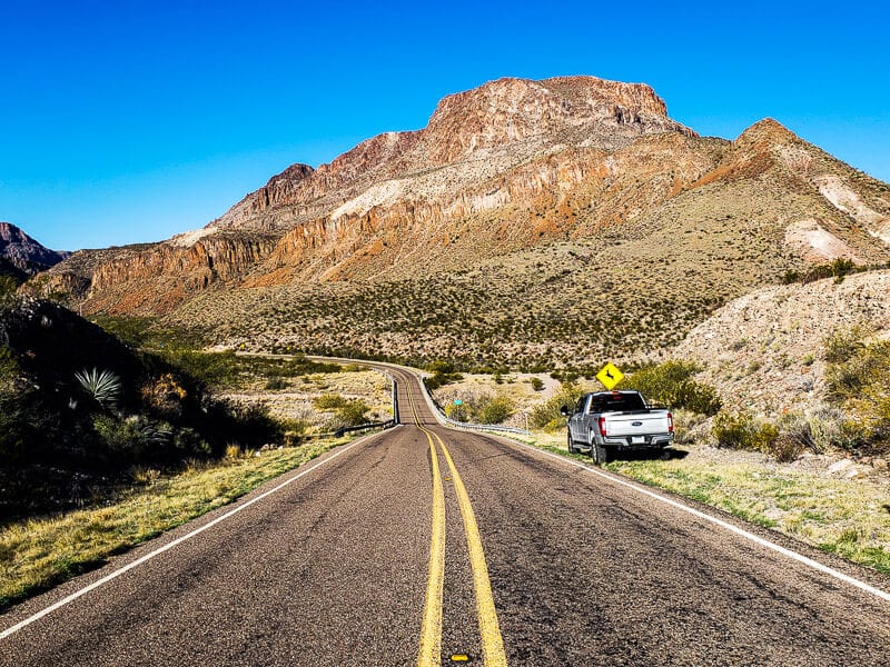 car on the road winding through Big Bend Ranch State Park, Texas