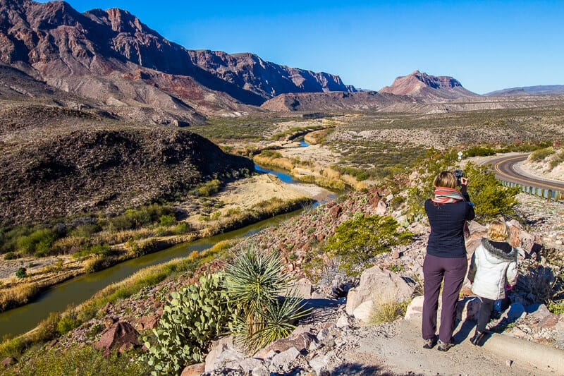 Big Bcaz and savannay looking at view of rio grande river going through the valley