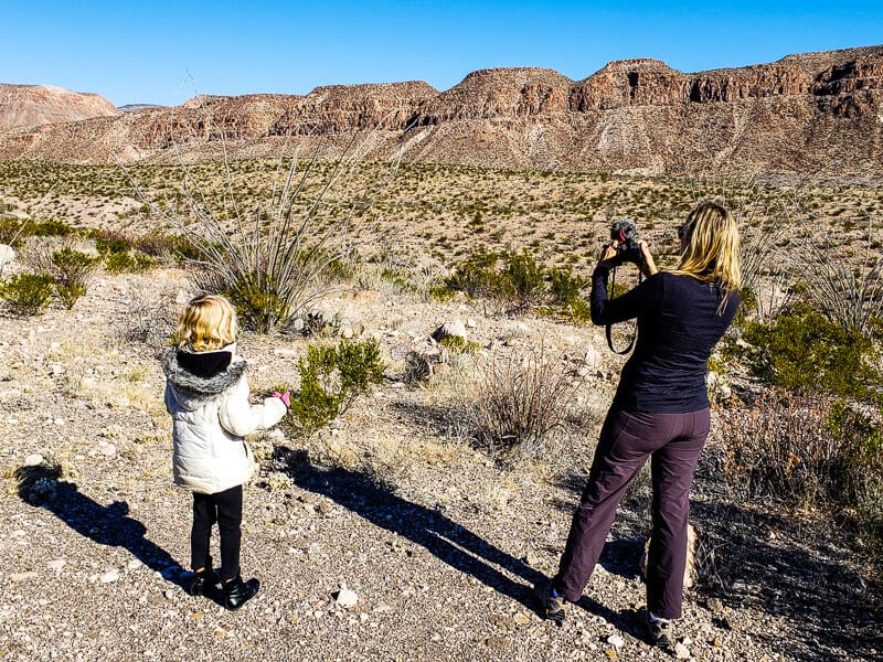 caz taking photo of rocky landscape