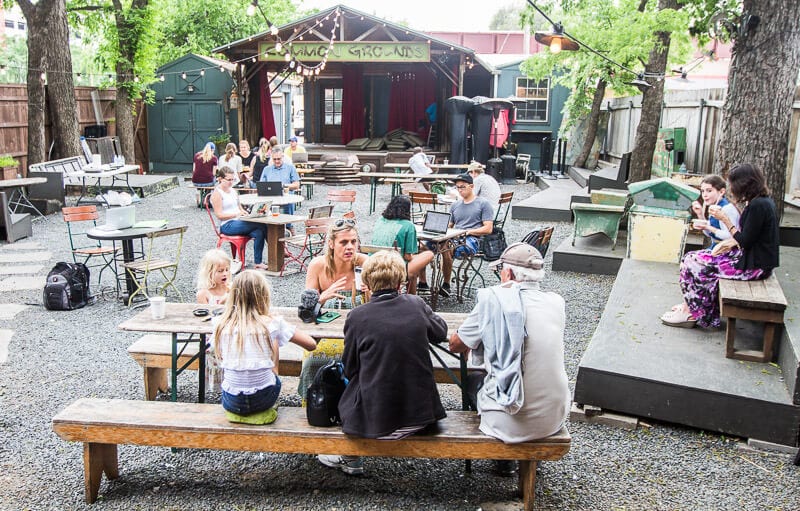 family sitting at table in garden