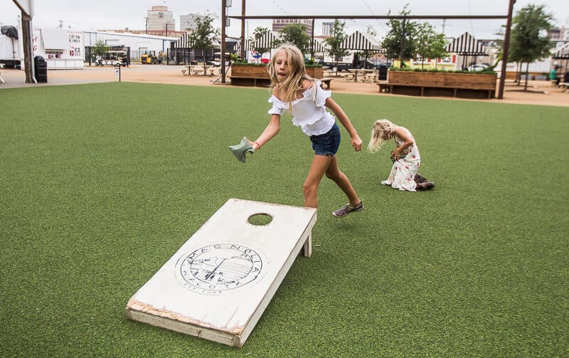 kalyra playing cornhole s