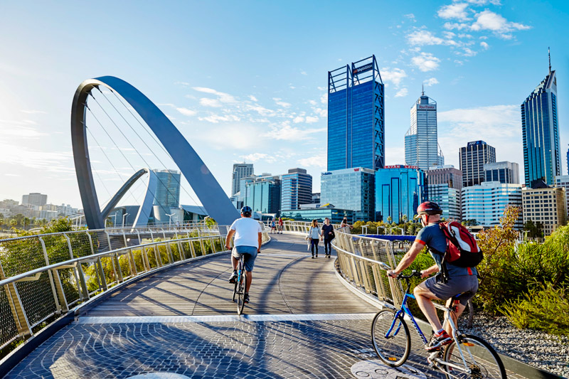 People riding bikes along Elizabeth Quay, Perth 