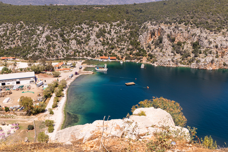 view from above of sandy beach between the cliffs