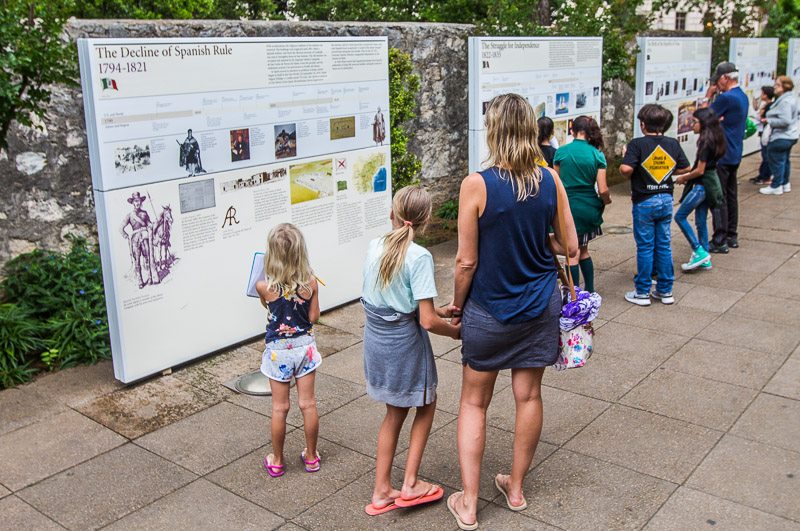 people looking at exhibitions