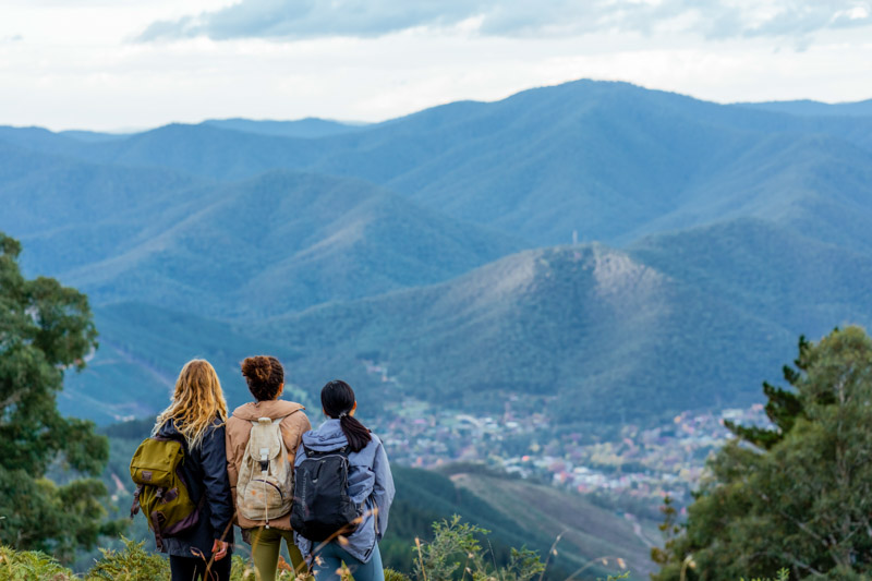 girls on hiking trail looking at mountains