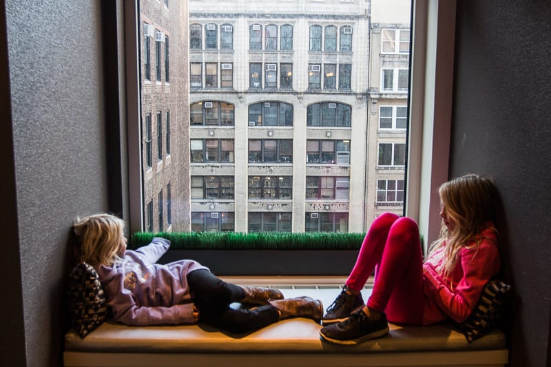 girls sitting on window ledge at INNSIDE New York Nomad hotel