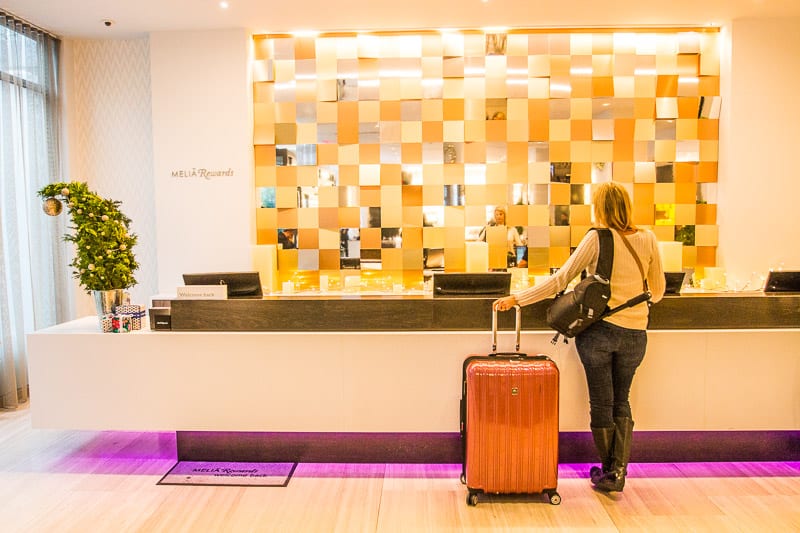 woman checking into Lobby of the INNSIDE New York Nomad hotel