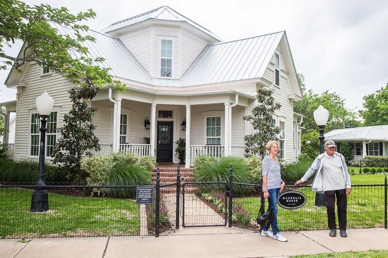 mum and dad posing magnolia house Fixer Upper Waco Texas